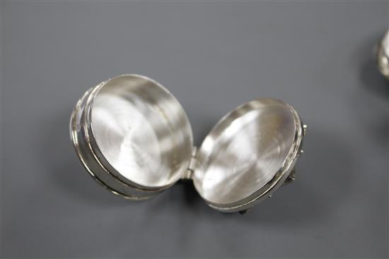 Three assorted modern silver pill boxes, including oval with hardstone lid, heart shaped and circular with shell inset lid, largest 4cm